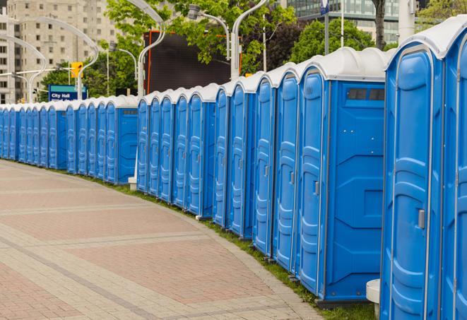 a row of sleek and modern portable restrooms at a special outdoor event in Bunkie